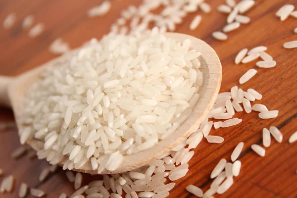 Rice in spoon — Stock Photo, Image