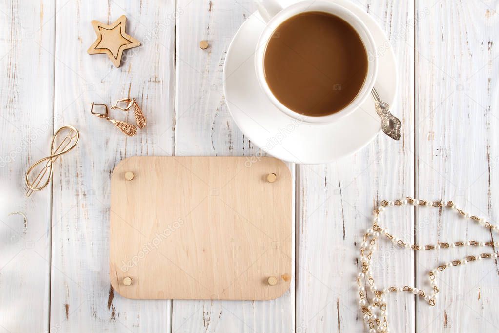 White cup of coffee and wooden board for writing text. Flatlay.