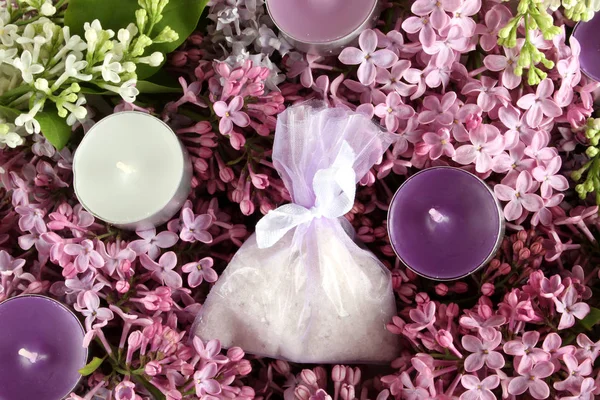 Spa therapy candles, aromatic salt and lilac — Stock Photo, Image