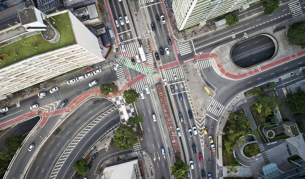Sao Paulo, Brazil, top view of intersection between the Paulista avenue and Consolacao street , crosswalk and cityscape.