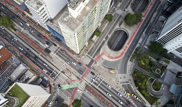 Sao Paulo, Brazil, top view of intersection between the Paulista avenue and Consolacao street , crosswalk and cityscape.
