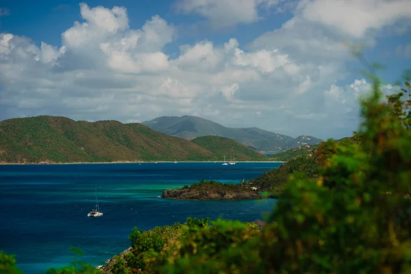 Beautiful bay in island with green hills and yachts, St. John US Virgin Islands.