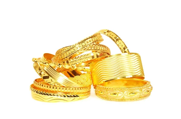 Gold bracelets on white — Stock Photo, Image