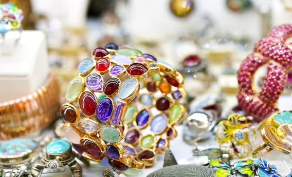 Golden ring with lot of colorful gems — Stock Photo, Image