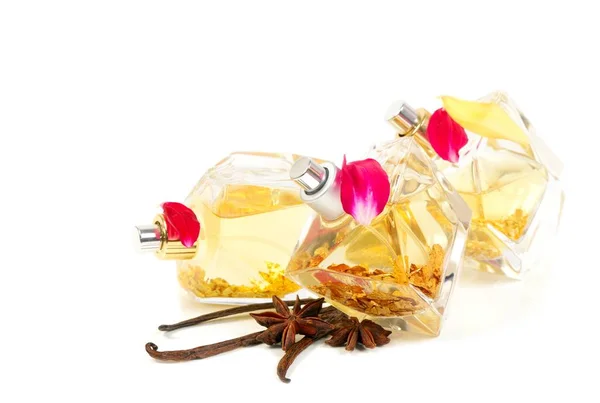 Perfumes with golden flakes inside, over white — Stock Photo, Image