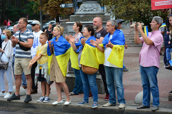 Kyiv, Ukraine - August 24, 2020: Veterans of the Russian-Ukrainian war, military, volunteers, activists, families of those killed in the war, and during the Revolution of Dignity walk along Khreshchatyk Street to applause from Ukrainians.