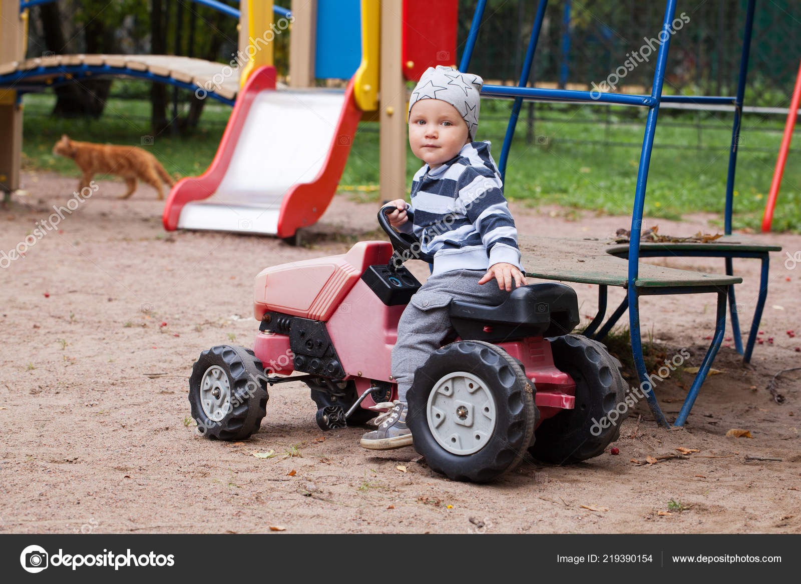 child driving toy car