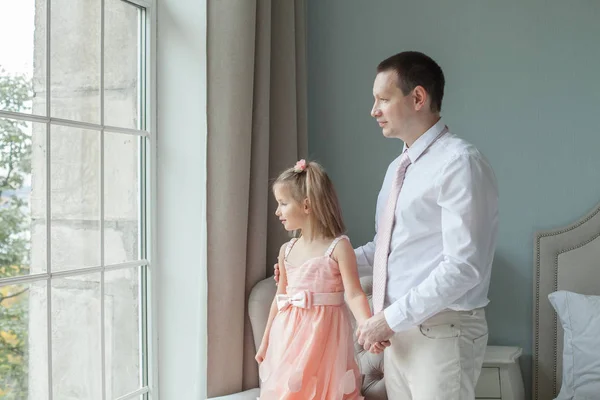 Dad and daughter together at home