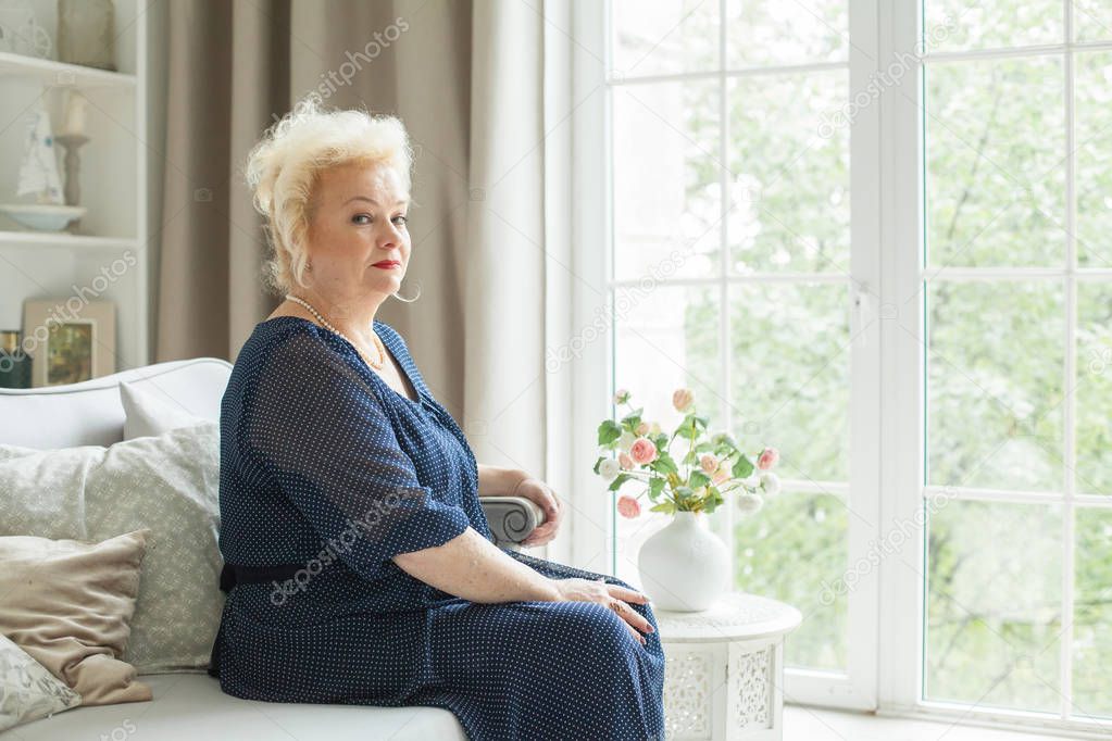 Portrait of beautiful senior woman at home