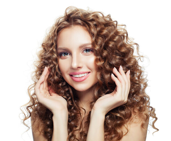 Cute model woman smiling and touching her hair her hand isolated on white background