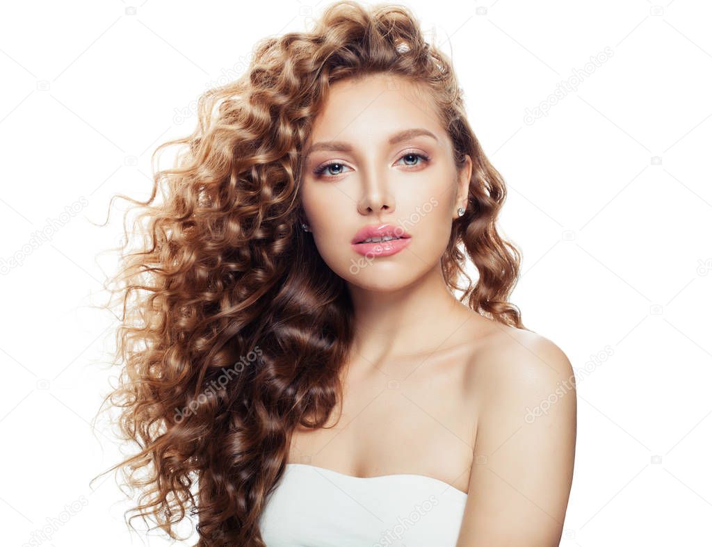 Young woman with healthy wavy hair and clear skin isolated on white