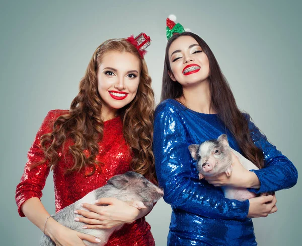 Christmas Fashion Model Women Party Dress Holding Little Pigs — Stock Photo, Image