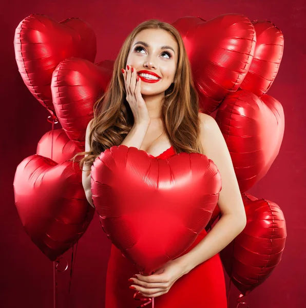 Excited Woman Red Dress Holding Balloons Red Heart Looking Surprised — Stock Photo, Image