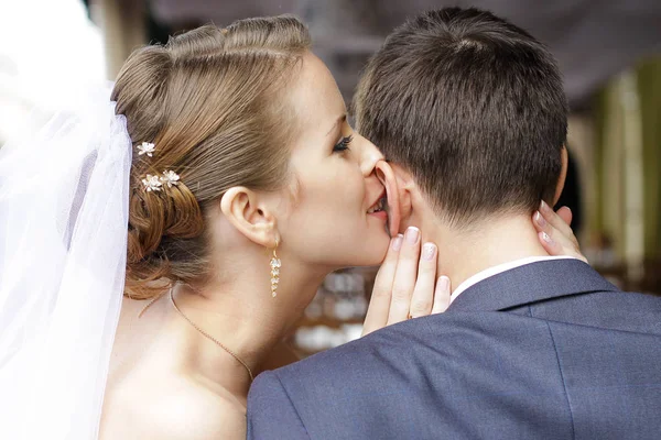 Bride is whispering I love you into his groom ear — Stock Photo, Image