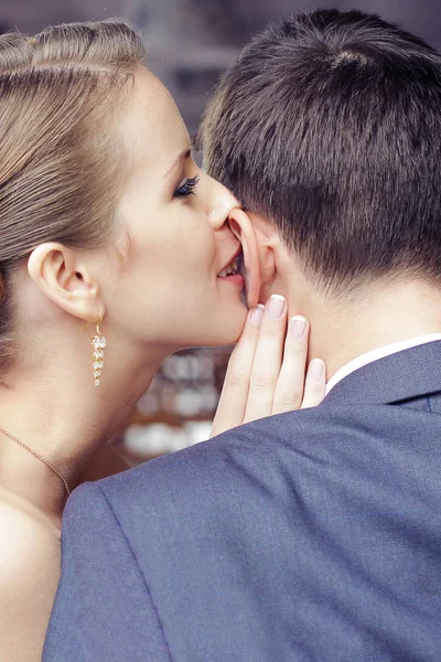 Woman is whispering I love you into his boyfriends ear — Stock Photo, Image