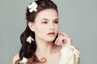 Young beautiful model woman with healthy skin portrait. Natural 