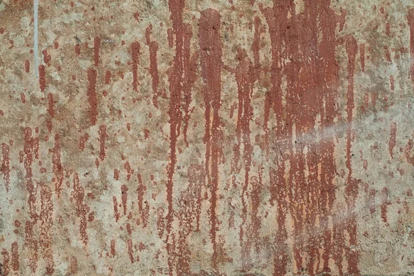 赤い塗料の汚れと古いテクスチャ壁の背景. — ストック写真