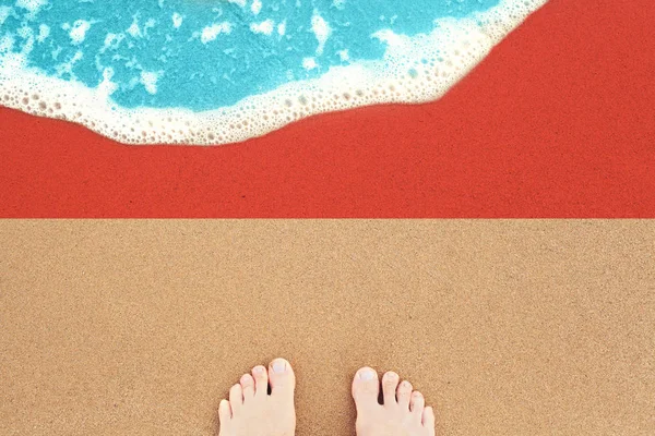 Feet on the sunny sandy beach with flag Indonesia. View from top — Stock Photo, Image