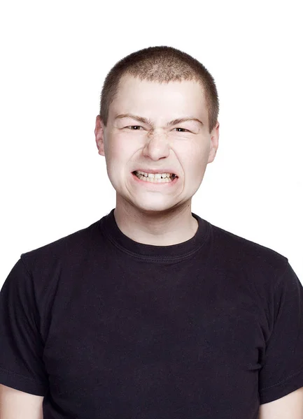 Retrato de un joven. Expresión facial. Cara de dientes . — Foto de Stock