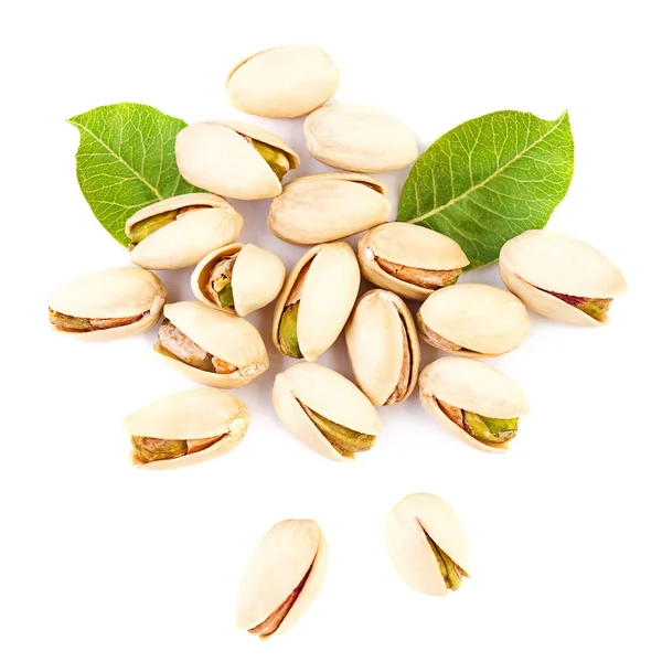 Pistachios isolated on white background. Pistachio and green leaves — Stock Photo, Image
