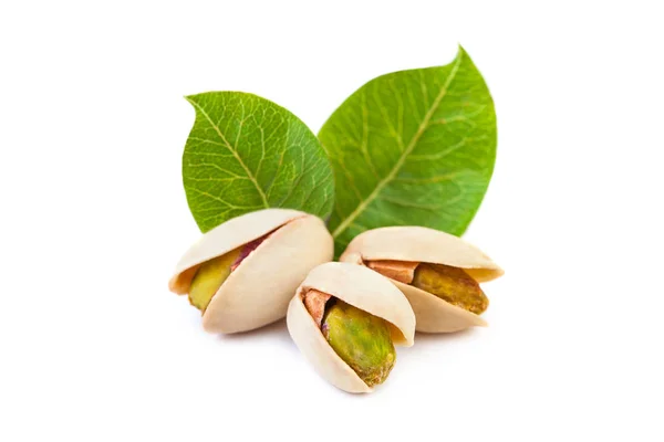 Pistachio nuts with leaves isolated on white background — Stock Photo, Image