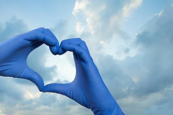 Heart against sky clouds background. Medicine and ambulance concept