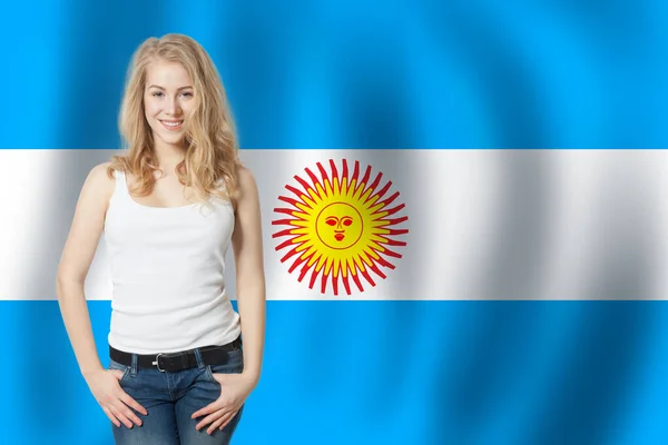 Portrait of happy woman student on the Argentina flag background. Travel and learn spanish language
