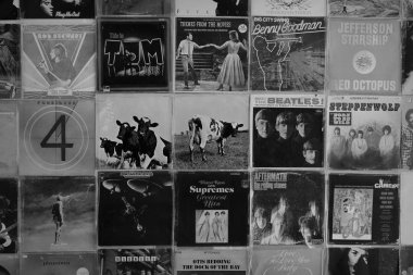 ATHENS, GREECE - AUGUST 29, 2018: Vintage pop rock music vinyl record album cover art displayed at record store. Black and white. clipart