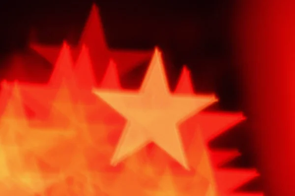 Red star shapes abstract blur — Stock Photo, Image