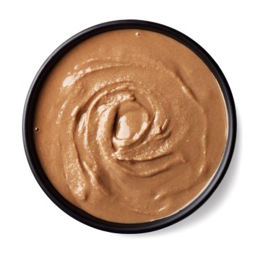 Tahin sosu (susam tohumu Yapıştır) beyaz arka plan üzerinde izole kase. Üstten görünüm