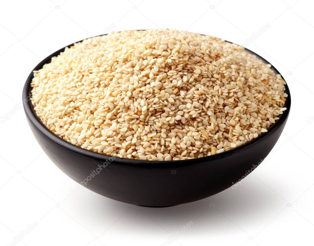 Black bowl of sesame seeds isolated on white background