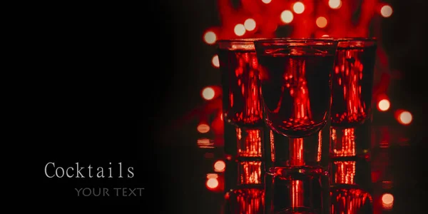 Red Alcohol Cocktails Shot Glasses Red Bokeh Light Black Background — Stock Photo, Image