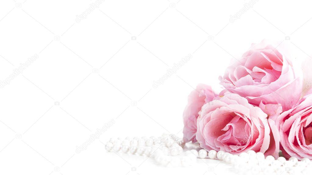 Beautiful pastel pink roses bunch and elegant bridal pearls isolated over white background. Wedding flower bouquet arrangement and classy jewelry. Bright soft clean reception invitation card and banner design.