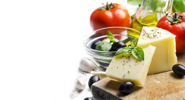 Goat cheese, olives, olive oil, tomato, garlic, basil and spices — Stock Photo, Image