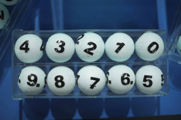 white balls with numbers for the game of lottery.