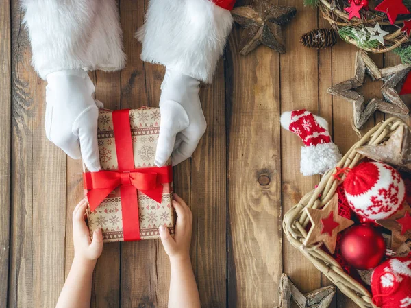 Merry Christmas Happy Holidays Hands Santa Claus Giving Mas Gift — Stock Photo, Image
