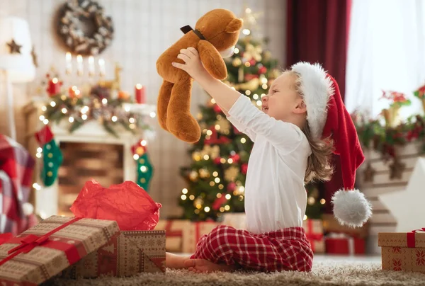 Child opening Christmas present — Stock Photo, Image