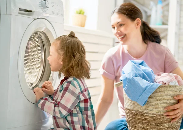 Family doing laundry — Stock Photo, Image