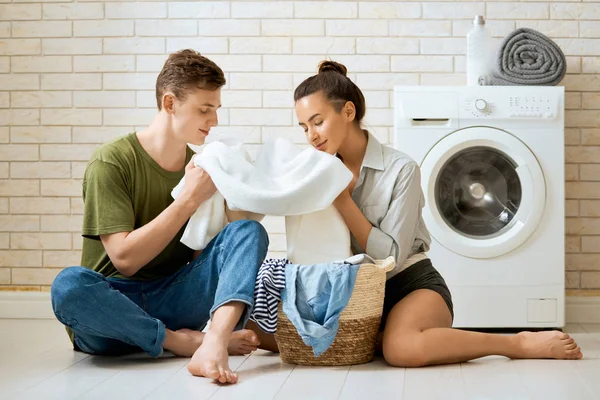 Loving couple is doing laundry — Stock Photo, Image