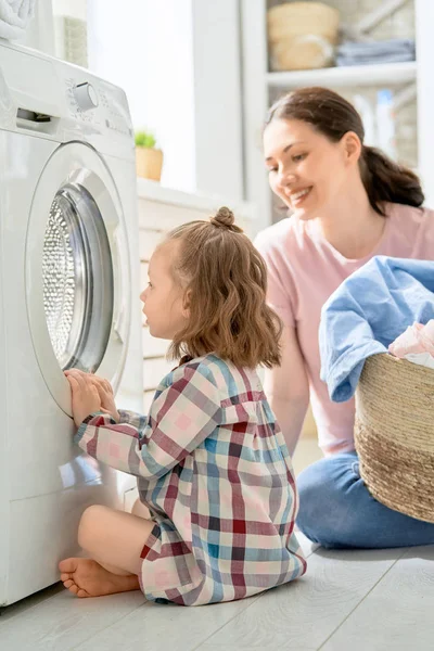 Family doing laundry — Stock Photo, Image