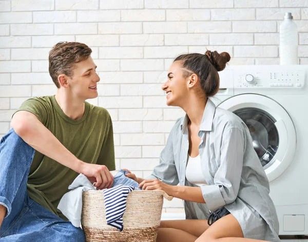 Loving couple is doing laundry — Stock Photo, Image