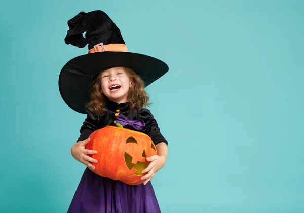 Little witch on turquoise background — Stock Photo, Image
