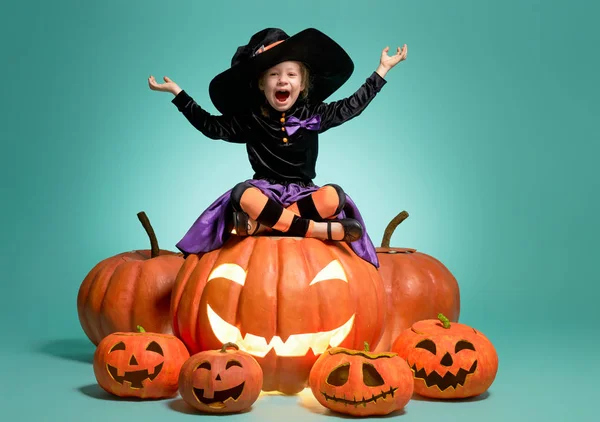 Little witch on turquoise background — Stock Photo, Image