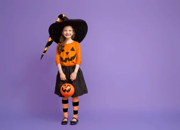 Little witch on purple background — Stock Photo, Image