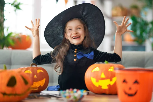 Little laughing girl in witch costume — Stock Photo, Image