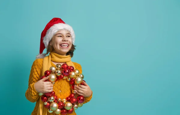 Girl in Santa hat on color background — Stock Photo, Image