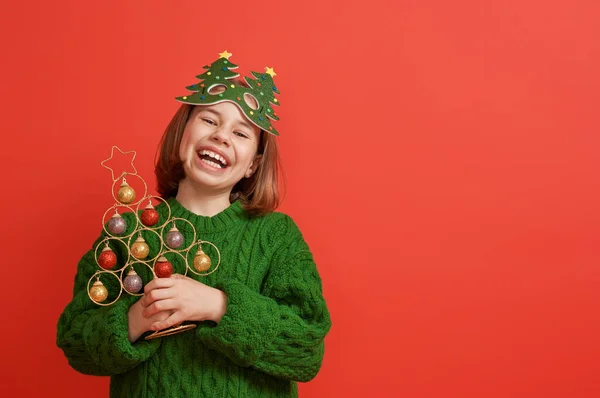 Girl with Christmas tree on bright color background — Stock Photo, Image