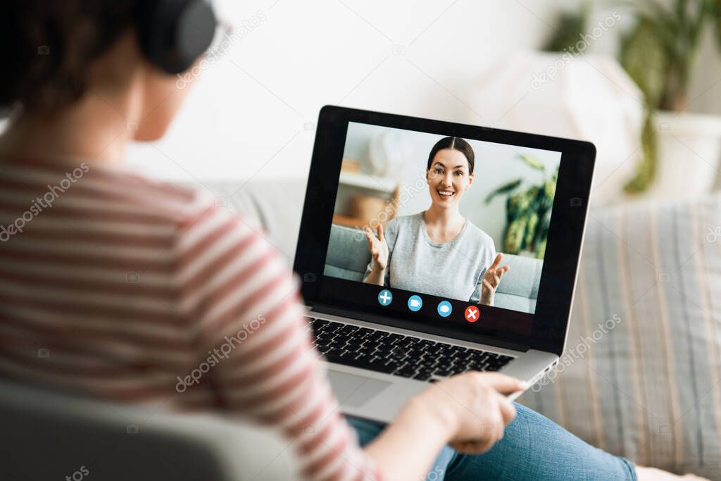 Young woman is using laptop pc for remote conversation and video call. 