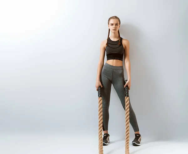 Athletic Young Woman Doing Crossfit Exercises Rope Grey Background — 스톡 사진