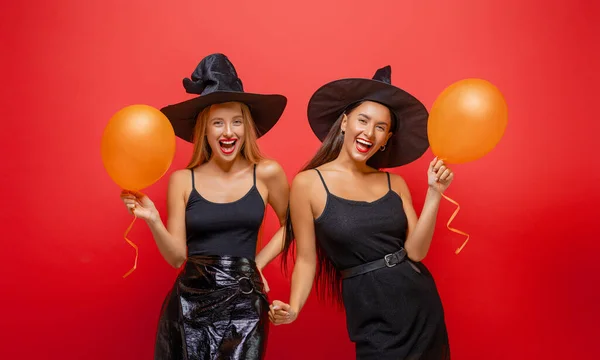 Happy Halloween Two Young Women Black Witch Costumes Party Red — Stock Photo, Image